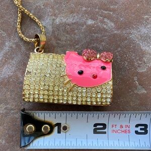 Hello Kitty Gold-Tone Necklace with Pink Crystal Purse Pendant